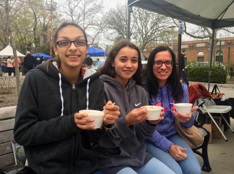 From left, Taylor Pina, Gabriella Montanez and Julie Foster, of Middleboro, enjoy cups of seafood bisque. BY MATTHEW BERNAT
